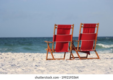 Red Beach Chairs At Public Beach In Florida, USA