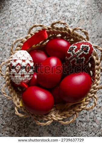 red and bead decorated easter eggs in a wicker basket 