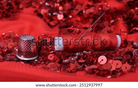 Red Beaded Fabric With Spool of Thread and Thimble 