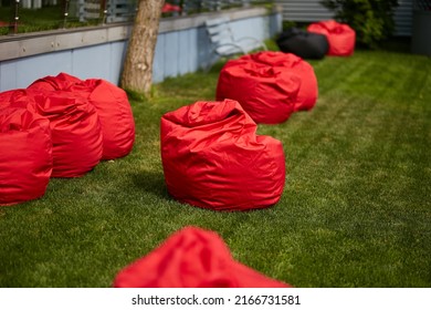 Red Bean Bag Chairs On Green Grass