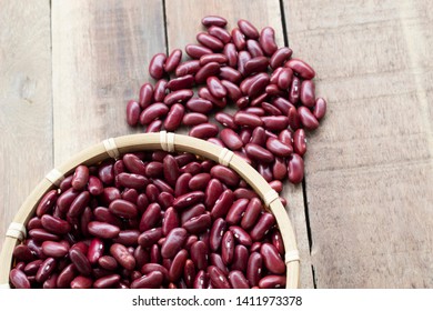 red bean  in bowl isolated on wood background