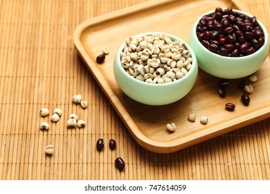 Red Beans And Coix Seed In Green Bowl On Bamboo 