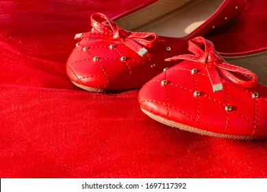 Red Beautiful Women's Shoes On Bright Fabric. Still Life Of A Fashionable Woman. Red Ballet Shoes On Red. Copy Space, Women's Shoe Store