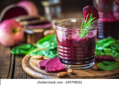 Red beetroot detox smoothie with spinach, apple juice and almonds - Healthy eating and weight loss concept