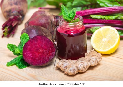 Red Beetroot, ginger and lemon smoothie on wooden Background. homemade detox drinks - Powered by Shutterstock