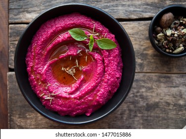 Red beetroot humus with fresh vegetables, healthy vegetable dish