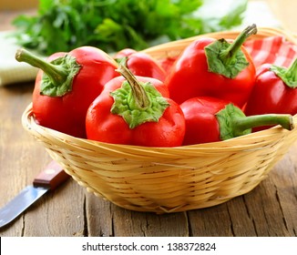  Red Bell Paprika Peppers In A Wicker Basket