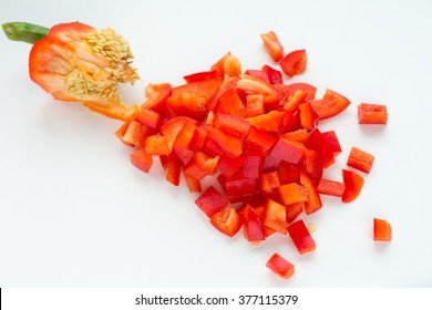 Red Bell Pepper, Diced With A Tail On A White Background