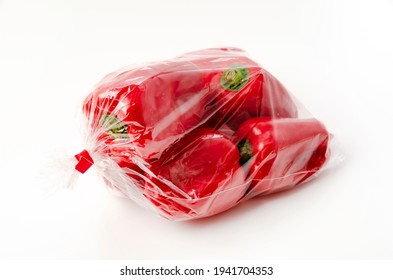 Red Bell Pepper In Plastic Bag On White Background