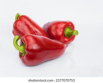 Red bell peppers (paprika, capsicum) isolated on white background with reflection - Powered by Shutterstock