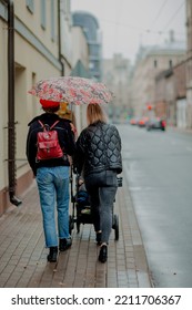 Red Beret Girl In Rainy City With Umbrella