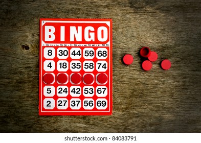 Red bingo card with winning chips