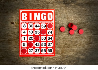Red bingo card with winning chips