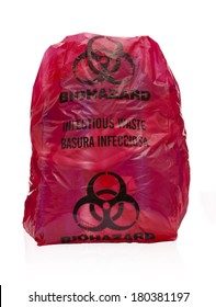 Red Bio-hazard Bag Filled With Medical Waste. Medical Waste Filled Red Bio-hazard Bag On White Background. Regulated Medical Waste Reduction And Minimization Practices.