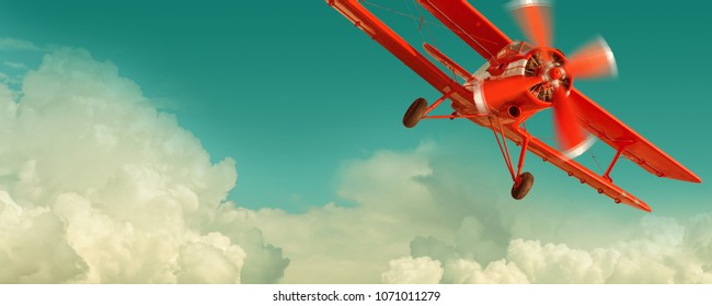 Red biplane flying in the cloudy sky. Retro style