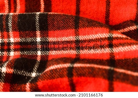 Red and black buffalo plaid pattern. Lumberjack background. Classic red Scottish gingham pattern texture.