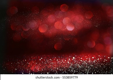 Red and black glitter vintage lights background. defocused