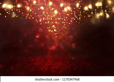 Red, Black And Gold Glitter Vintage Lights Background. Defocused