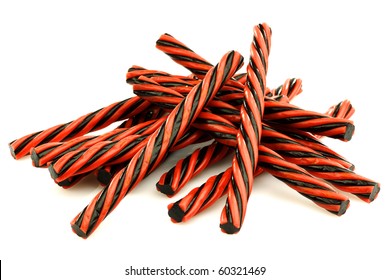 Red And Black Licorice Candy On A White Background