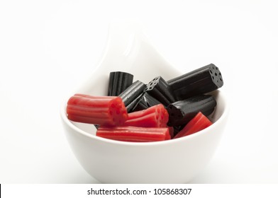 Red And Black Licorice On White Background