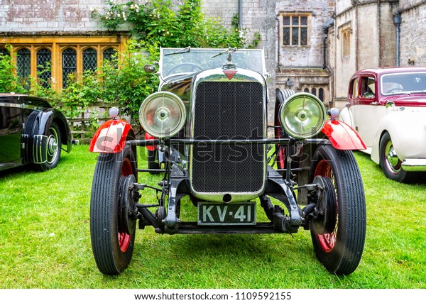 Red & Black luxury vintage sports\
car taken in Puddletown, Dorset, UK on 10 June\
2018