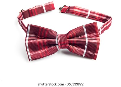 Red black plaid bow tie isolated on white - Powered by Shutterstock