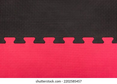 Red And Black Puzzle Rubber Mat Pattern Gym Floor Background Abstract Design.