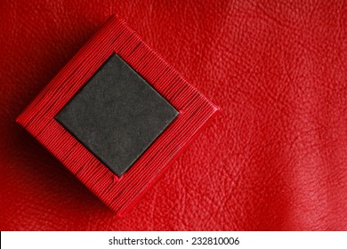 Red Black Rectangular Ring Jewellery Box On Leather Background