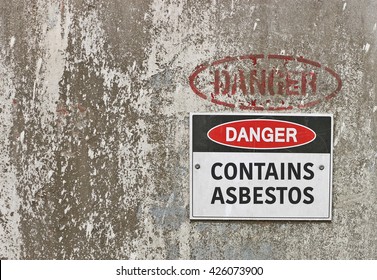 red, black and white Danger, Contains Asbestos warning sign