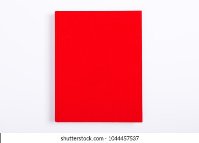 Red Blank Closed Book, Colored Cover Mock Up On White Background, Top View And Flat Lay