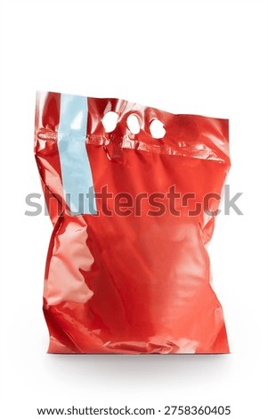 Red blank plastic packaging bag isolated on white background, mockup template for branding, product packaging design, minimal retail container, generic shopping bag concept. 