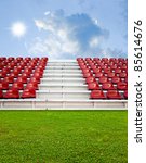 Red bleachers in the arena with sky background