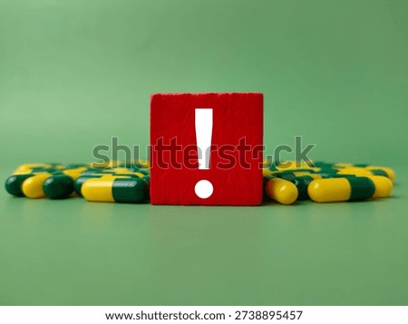 The red block with an exclamation mark represents a critical alert or caution regarding medication.