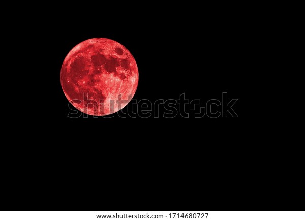 Red\
bloody moon on black sky as background, full moon\
