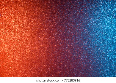 Red and blue abstract glitter background, shiny blurred bokeh on corners and sharp in center