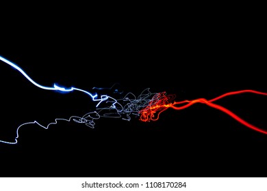 red and blue abstract lines by using long exposure. Light painting on black background