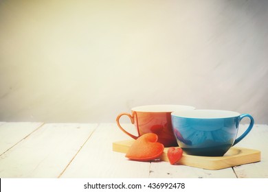 red and blue coffee cup on wooden tray / two red heart on old white wood table vintage style - Shutterstock ID 436992478