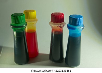 Red, Blue Green And Yellow Food Coloring Bottles