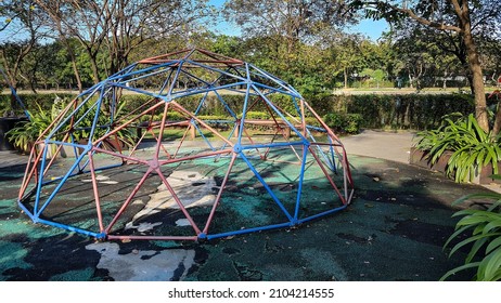 Red and blue Jungle Gym - Dome Climber, playground equipment in park. - Powered by Shutterstock