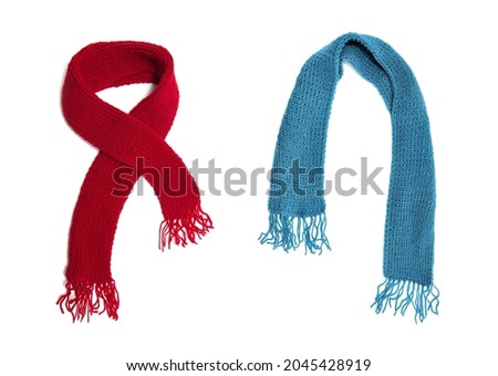 Red and blue knitted scarf on a white background.