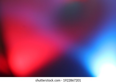 a red   blue light in blurred photo to add aesthetic impression to the photo