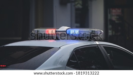 Red and blue light flasher. Police car in the city