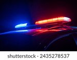 Red and blue lights of a police car at night, stock photo