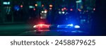 Red and blue lights of a police car close up in the evening, stock photo