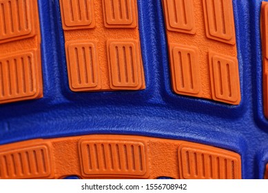 Red Blue Plastic Texture Of A Piece Of The Sole On The Shoe