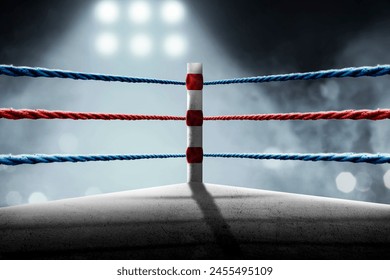 Red and blue rope on the boxing ring corner in the stadium arena - Powered by Shutterstock