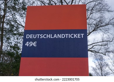 a red and blue sign shows "Deutschlandticket 49€" which means a train ticket for germany for just 49€ - Shutterstock ID 2223001705