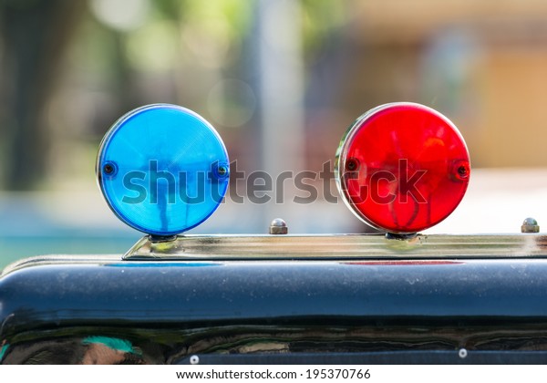Red And Blue Sirens On Car\
Top