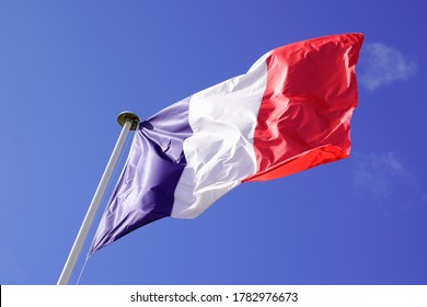 Red Blue White French Flag On Summer Sky