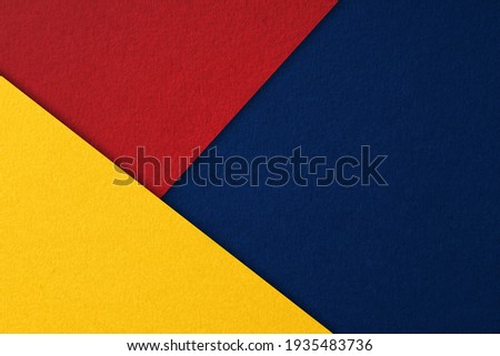 Red, blue and yellow abstract geometric composition background from thick paper sheets, cardboard.